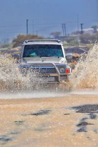 a truck driving through a river